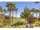 View of a lush golf course from behind trees at 266 Cullerton St, Las Vegas, NV 89148