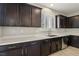 Kitchen with dark brown cabinets, white countertops, and stainless steel appliances at 266 Cullerton St, Las Vegas, NV 89148