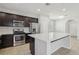 Modern kitchen with stainless steel appliances and an island with white countertop at 266 Cullerton St, Las Vegas, NV 89148