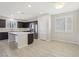 Modern kitchen with dark cabinetry, stainless steel appliances, and an island at 266 Cullerton St, Las Vegas, NV 89148