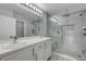 Bathroom boasts double vanity, a large walk-in shower, and gray tile at 27 E Agate Ave # 505, Las Vegas, NV 89123