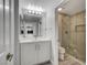 Modern bathroom features a white vanity, updated fixtures, and a glass shower at 27 E Agate Ave # 505, Las Vegas, NV 89123