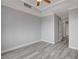 Light grey walls and wood-look floors in this bedroom at 27 E Agate Ave # 505, Las Vegas, NV 89123