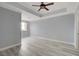 Spacious bedroom with wood-look floors and ceiling fan at 27 E Agate Ave # 505, Las Vegas, NV 89123