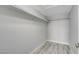 Large walk-in closet with wood-look floors and shelving at 27 E Agate Ave # 505, Las Vegas, NV 89123