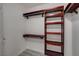 Walk-in closet with wood shelving and hanging rods at 27 E Agate Ave # 505, Las Vegas, NV 89123