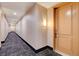 Apartment hallway with carpet and modern apartment door at 27 E Agate Ave # 505, Las Vegas, NV 89123