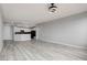 Spacious living room with light gray walls and wood-look flooring at 27 E Agate Ave # 505, Las Vegas, NV 89123