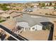 Aerial view showcasing a house's unique design and backyard amenities at 308 Belfast St, Henderson, NV 89015