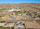 Aerial view of a house with a pool and a large yard in a residential neighborhood at 308 Belfast St, Henderson, NV 89015