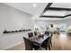 Dining area with dark wood table and view to adjacent rooms at 308 Belfast St, Henderson, NV 89015