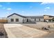 Modern single story home with a large driveway and desert landscaping at 308 Belfast St, Henderson, NV 89015