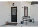 Welcoming entryway with black door and decorative bench at 308 Belfast St, Henderson, NV 89015