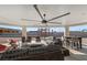 Relaxing covered patio with seating area and ceiling fan at 308 Belfast St, Henderson, NV 89015