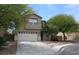 Two-story house with attached garage and landscaping at 3309 Conterra Park Ave, North Las Vegas, NV 89081