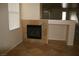 Living room with a gas fireplace and tile surround at 3309 Conterra Park Ave, North Las Vegas, NV 89081