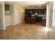 Open concept kitchen with island and tile flooring at 3309 Conterra Park Ave, North Las Vegas, NV 89081