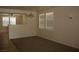 Bright living room with neutral walls and carpet at 3309 Conterra Park Ave, North Las Vegas, NV 89081