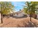 Large backyard with gravel, trees, and a firepit at 3378 Del Marino St, Las Vegas, NV 89121