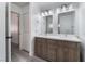 Bathroom with double vanity, updated fixtures, and grey wood cabinets at 3378 Del Marino St, Las Vegas, NV 89121