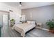 Spacious bedroom with gray walls, wood-look flooring, and mirrored closet doors at 3378 Del Marino St, Las Vegas, NV 89121