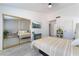 Bright bedroom with mirrored closet doors and a striped comforter at 3378 Del Marino St, Las Vegas, NV 89121