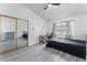 Bright bedroom with mirrored closet doors and a ceiling fan at 3378 Del Marino St, Las Vegas, NV 89121