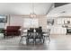 Dining area features a table with six chairs and an open concept to the kitchen at 3378 Del Marino St, Las Vegas, NV 89121