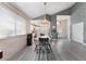 Bright dining area with gray flooring and a farmhouse style table at 3378 Del Marino St, Las Vegas, NV 89121