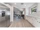 Modern kitchen with stainless steel refrigerator and white shaker cabinets at 3378 Del Marino St, Las Vegas, NV 89121