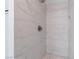 Shower with marble-look tile and a built-in niche at 3378 Del Marino St, Las Vegas, NV 89121