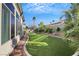 Landscaped backyard with artificial turf and desert landscaping at 385 Apple River Ct, Las Vegas, NV 89148