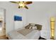 Cozy bedroom with ceiling fan, dresser, and TV at 385 Apple River Ct, Las Vegas, NV 89148