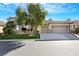 Two-car garage and nicely landscaped front yard at 385 Apple River Ct, Las Vegas, NV 89148