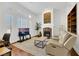 Living room with stone fireplace and built-in shelving at 385 Apple River Ct, Las Vegas, NV 89148