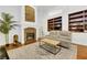 Living room with stone fireplace and built-in shelving at 385 Apple River Ct, Las Vegas, NV 89148