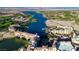 Breathtaking aerial view of lakefront property with golf course and vibrant buildings nestled along the shoreline at 43 Strada Loreto, Henderson, NV 89011