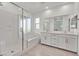 Modern bathroom with a separate shower and soaking tub, and a double vanity at 43 Strada Loreto, Henderson, NV 89011