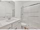 Clean, modern bathroom featuring a glass-enclosed shower, white vanity, and updated fixtures at 43 Strada Loreto, Henderson, NV 89011