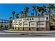 Elegant community sign for Lake Las Vegas showcasing various amenities amid palm trees under a bright blue sky at 43 Strada Loreto, Henderson, NV 89011