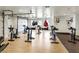 Large gym featuring hanging punching bags and machines with access to garage doors at 43 Strada Loreto, Henderson, NV 89011