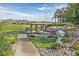 Inviting community picnic area featuring a covered table and barbecue with scenic golf course views at 43 Strada Loreto, Henderson, NV 89011