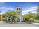 Charming restaurant building with stone accents, outdoor seating, and lush landscaping in a vibrant setting at 43 Strada Loreto, Henderson, NV 89011