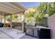 Relaxing backyard with a pergola, built-in grill, and patio furniture at 4412 Desert Park Ave, North Las Vegas, NV 89085