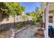 Landscaped backyard with a gravel pathway and decorative wall at 4412 Desert Park Ave, North Las Vegas, NV 89085