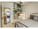 Bright bedroom with a unique shelving unit and comfortable bed at 4412 Desert Park Ave, North Las Vegas, NV 89085