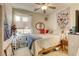 Cozy bedroom featuring a butterfly tapestry and ample natural light at 4412 Desert Park Ave, North Las Vegas, NV 89085