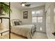 Guest bedroom with metal bed frame and window at 4412 Desert Park Ave, North Las Vegas, NV 89085