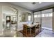 Bright dining area with wood table and access to the living room at 4412 Desert Park Ave, North Las Vegas, NV 89085