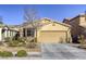 Attractive single-story home with a two-car garage and mature landscaping at 4412 Desert Park Ave, North Las Vegas, NV 89085